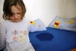 Frustration and embarrassment of a bed-wetting child.
