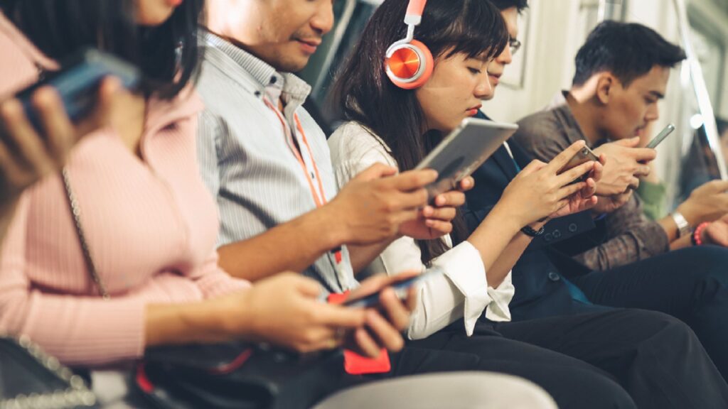 Video gaming on public transport is a common sight.